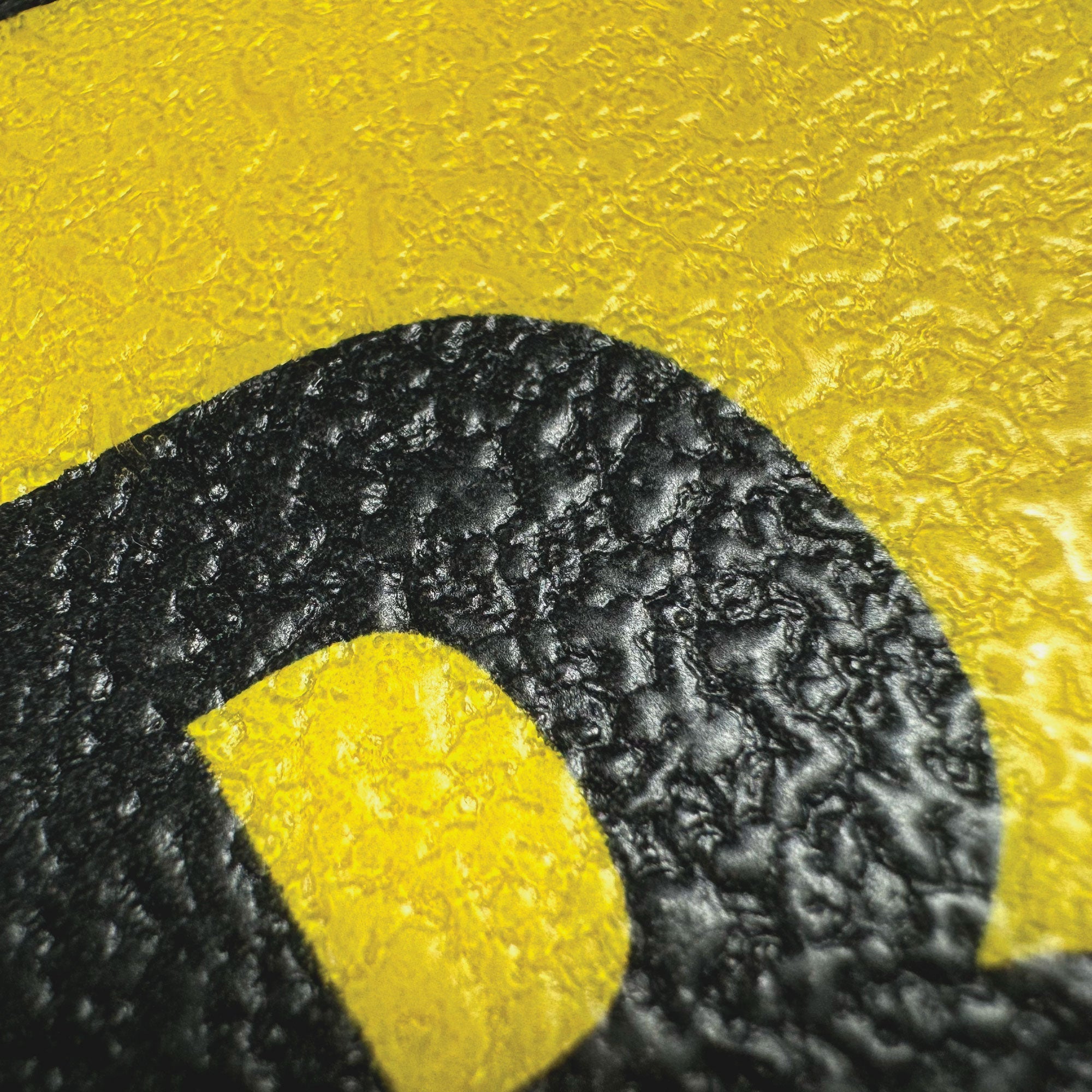 BC08YPK-series Butt Cut Black on Yellow Inventory Location Floor Markers 8 Inch High Numbers (5 /pkg) Close up of textured surface