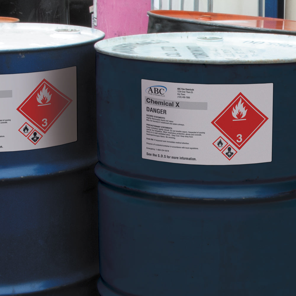 VynMark™ Adhesive Printable Supplier Laser Labels printed with chemical and company details on a drum